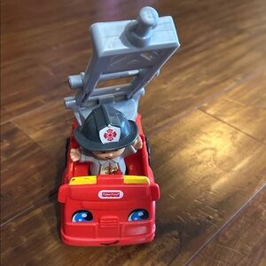 Fisher-Price Little People fire truck with ladder and firefighter fireman figure